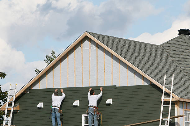 Professional Siding technician working in Arlington, TX